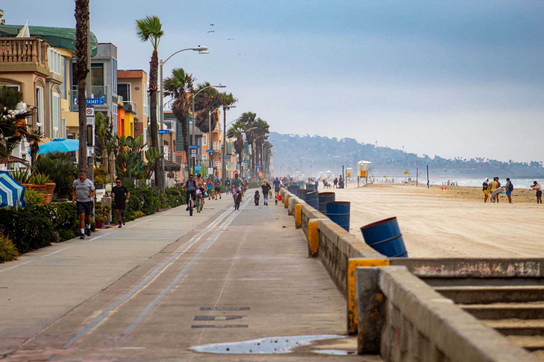 The Pacific Beach boardwalk (Ocean Front Walk) lined with palm trees in San Diego