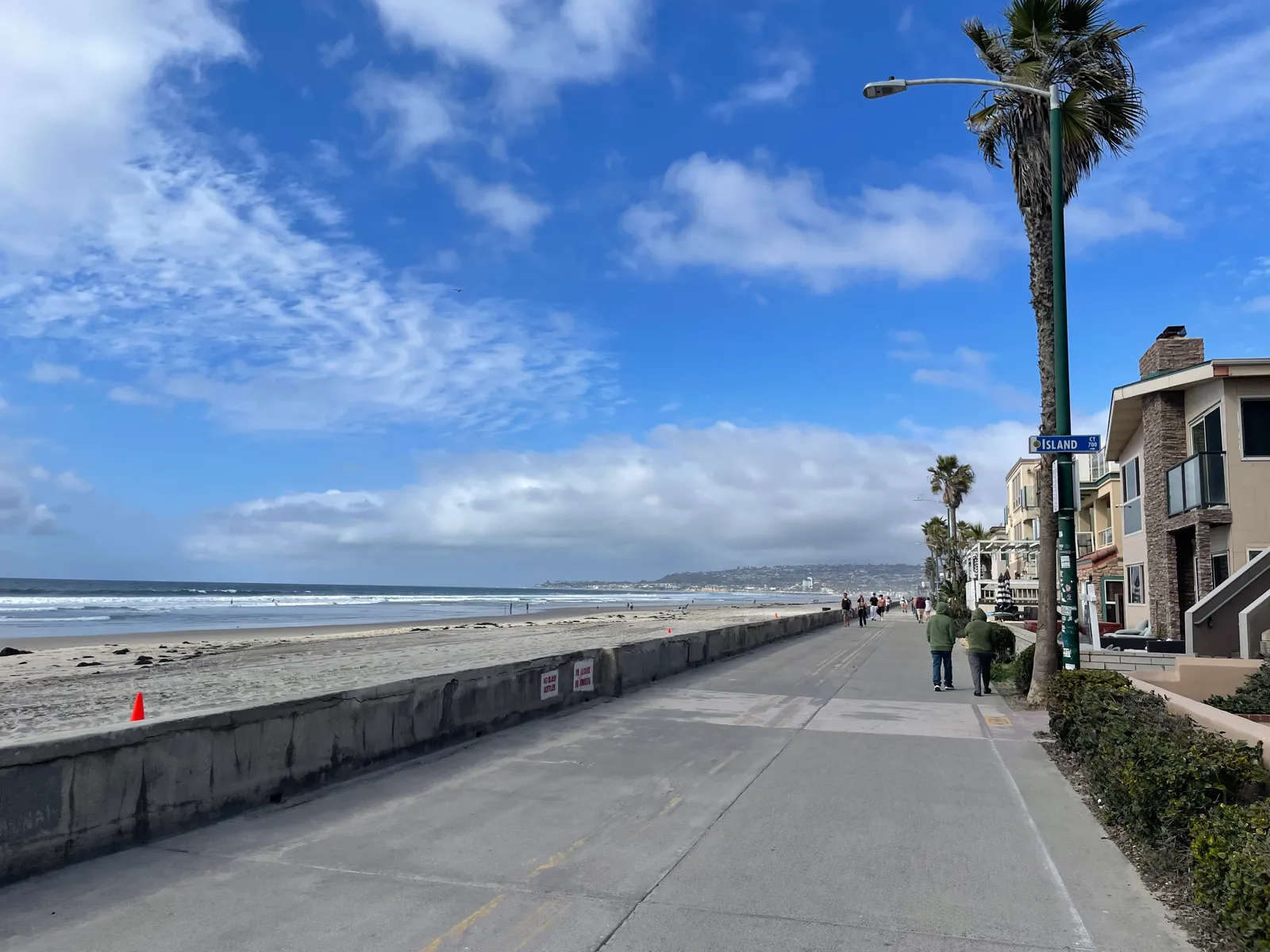 The Mission Beach boardwalk (Ocean Front Walk) looking north along the seawall in San Diego